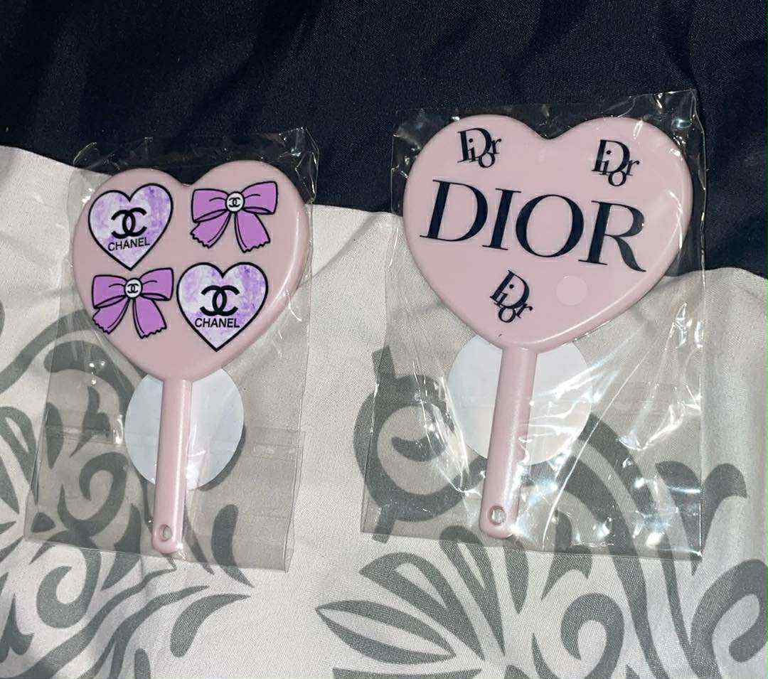 Designer hand mirror