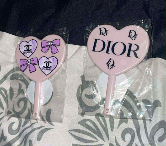 Designer hand mirror